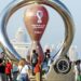 2022-10-07 15:27:48 Photo taken on 07 October 2022. People take photos in front of the Fifa World Cup 2022 Qatar countdown clock in Doha - Qatar. ahead of the FIFA 2022 World Cup football competition. netherlands out - belgium out (Photo by Noushad Thekkayil / ANP MAG / ANP via AFP)