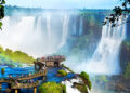 Tourists at Iguazu Falls, one of the world's great natural wonders, on the border of Brazil and Argentina.