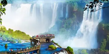 Tourists at Iguazu Falls, one of the world's great natural wonders, on the border of Brazil and Argentina.